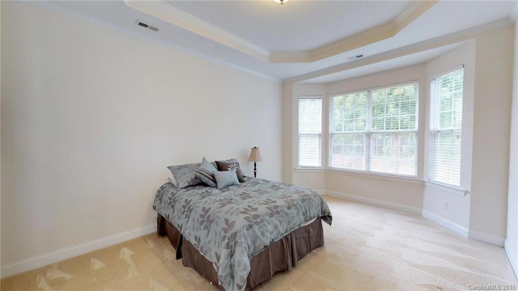 1369 Secret Path Drive Fort Mill, SC 29708 - Photo 13 of 22 a living room with a bed and a large window