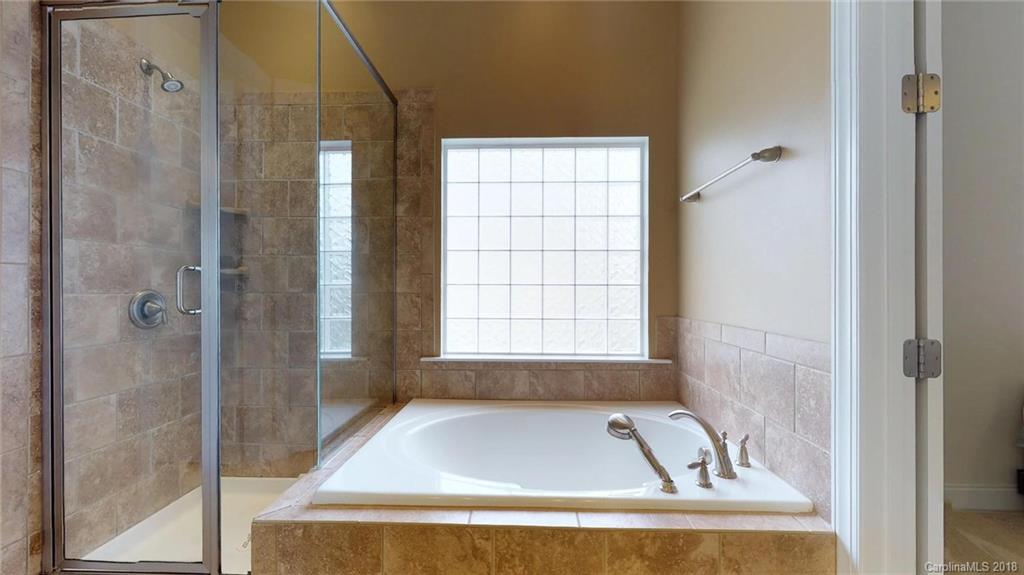 1369 Secret Path Drive Fort Mill, SC 29708 - Photo 15 of 22 a white bath tub sitting next to a window
