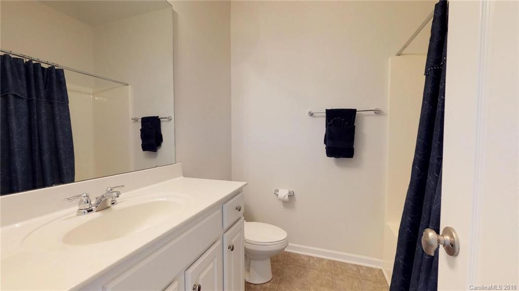 1369 Secret Path Drive Fort Mill, SC 29708 - Photo 18 of 22 a bathroom with a granite countertop sink toilet and mirror