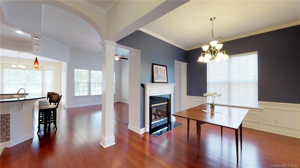 1369 Secret Path Drive Fort Mill, SC 29708 - Photo 4 of 22 a view of a dining room with furniture window and wooden floor