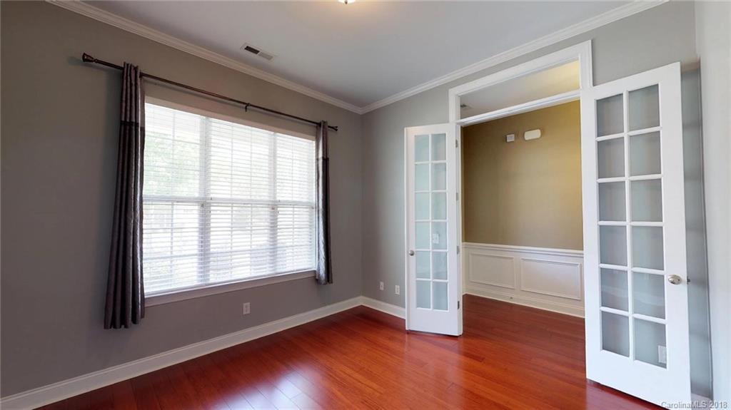 1369 Secret Path Drive Fort Mill, SC 29708 - Photo 5 of 22 a view of an empty room with wooden floor and a window
