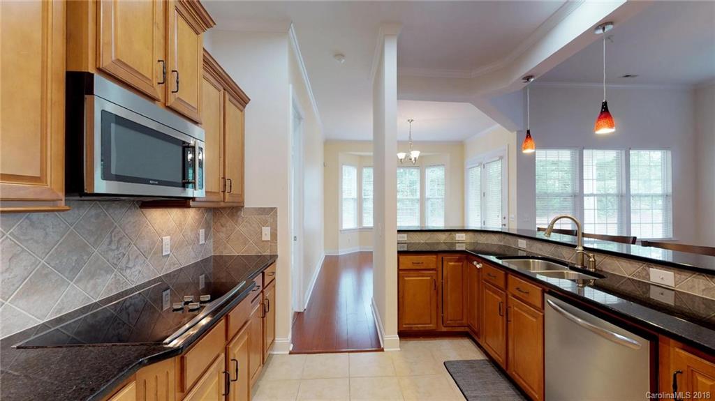 1369 Secret Path Drive Fort Mill, SC 29708 - Photo 6 of 22 a kitchen with a sink and a stove top oven