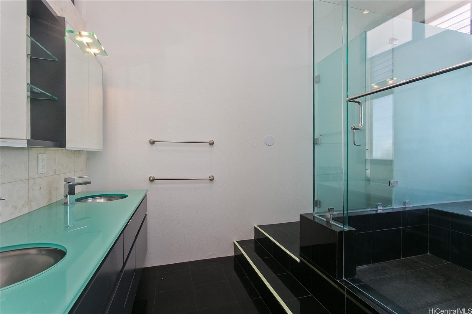 600 Kahiau Loop Honolulu, HI 96821 - Photo 18 of 19 a room with sink washer and dryer