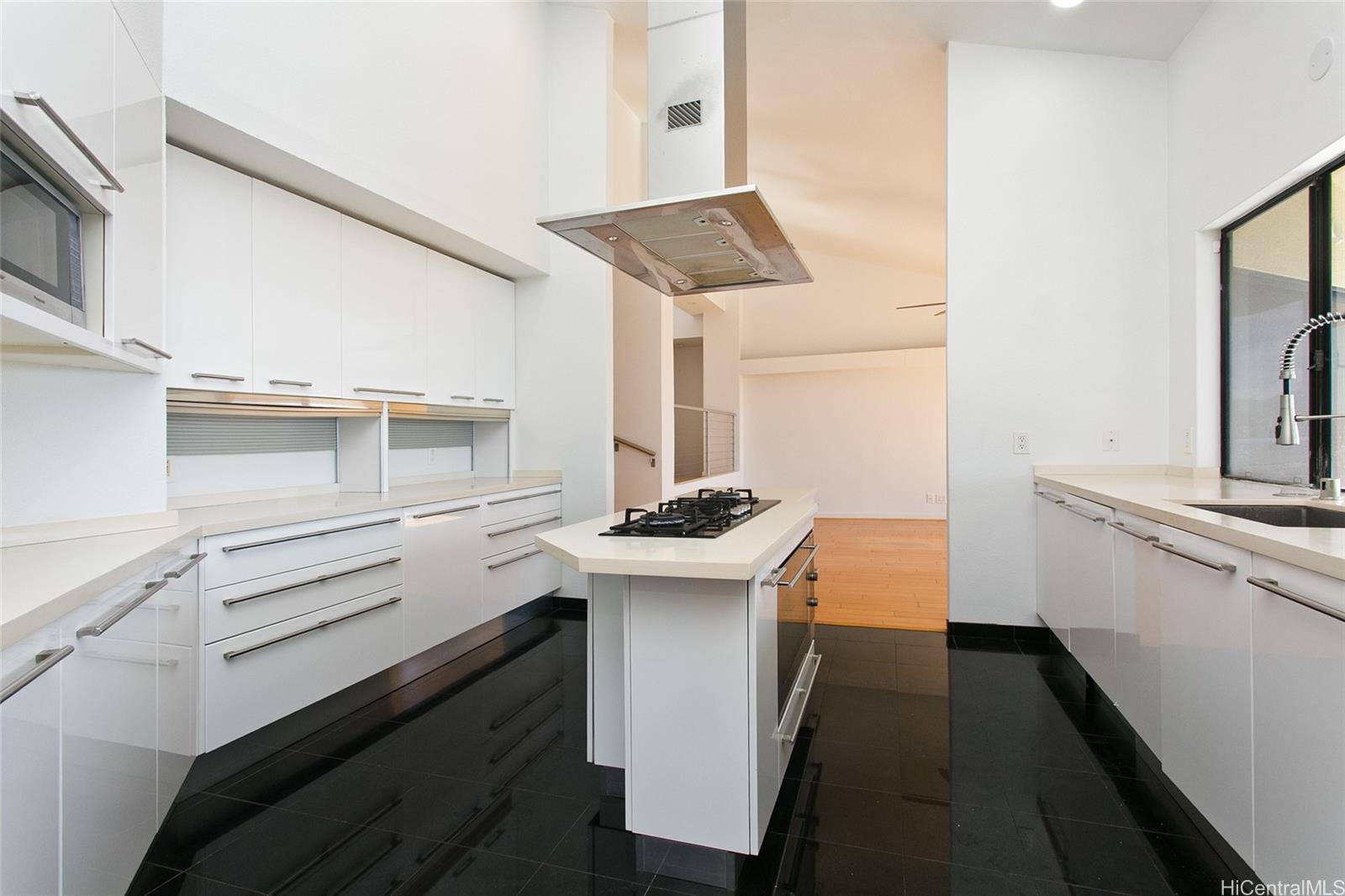 600 Kahiau Loop Honolulu, HI 96821 - Photo 5 of 19 a kitchen with stainless steel appliances a stove and more cabinets