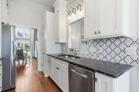 a kitchen with a sink and cabinets