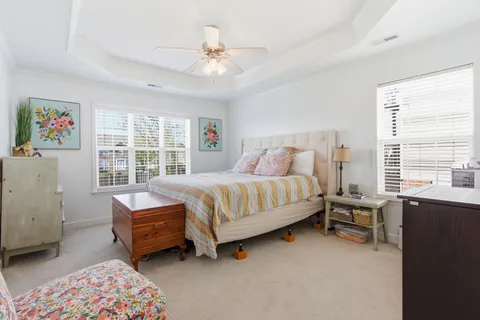 a spacious bedroom with a bed and a window