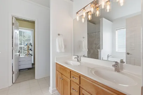 a bathroom with a bathtub and next to a window