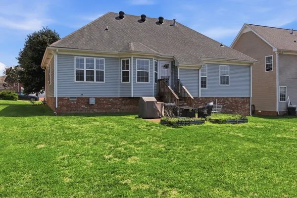 a view of a yard in front of a house