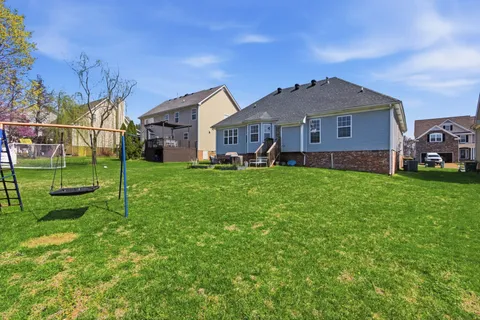 a view of a garden with a building in the background