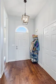 a view of a room with toys and wooden floor