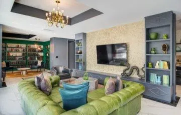 a living room with furniture and a flat screen tv