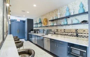 a kitchen with stainless steel appliances granite countertop a sink and a stove