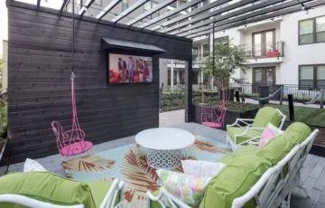 a outdoor living space with furniture and a fireplace