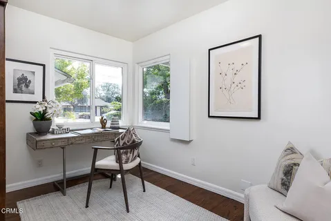 a view of a patio with table and chairs with wooden floor