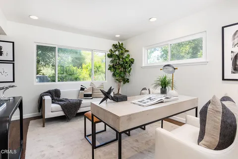 a view of a workspace with furniture