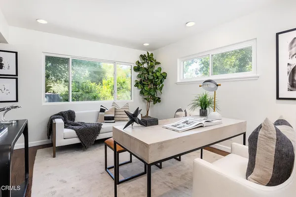 a view of a workspace with furniture