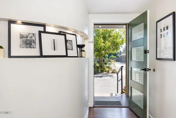 a view of front door with wooden floor