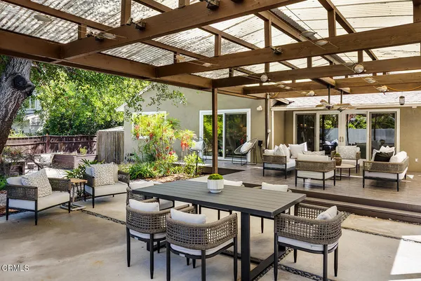 a view of a patio with a table and chairs