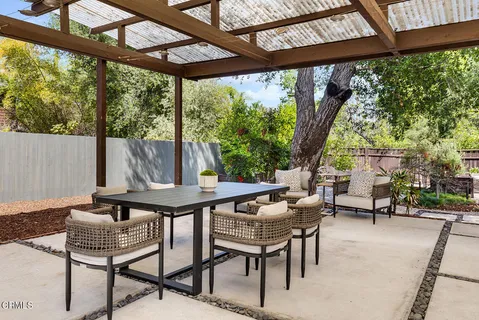 a outdoor living space with furniture and garden view