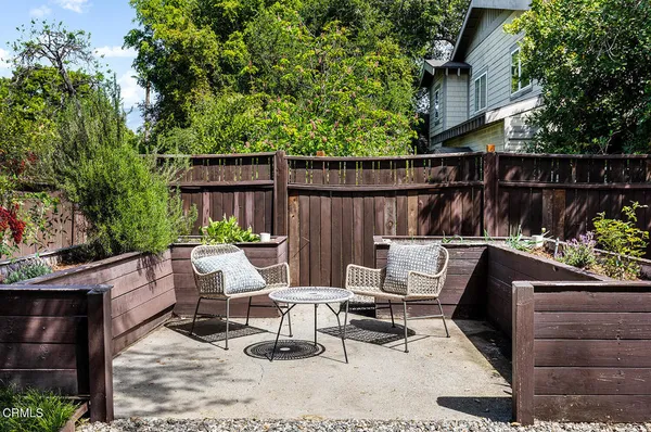 a view of yard with patio