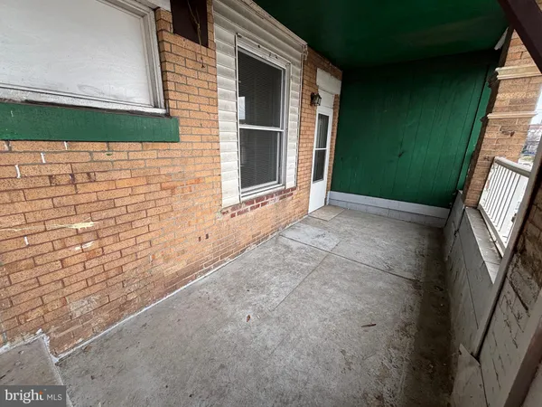 a view of a backyard both side of the house