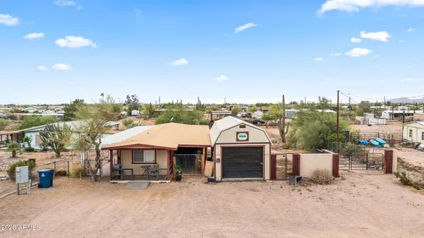 a view of a house with a yard and garage