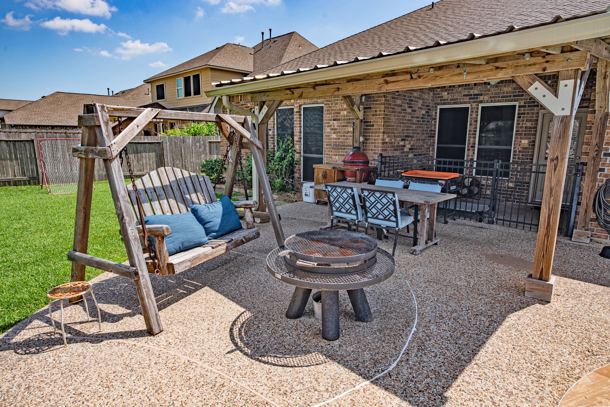 1283 Laurel Lane Angleton, TX 77515 - Photo 30 of 40 The patio "under roof" is fenced in w/gate lock for child safety. Additional 12 x 18 wood patio provides a shaded area for your backyard enjoyment.