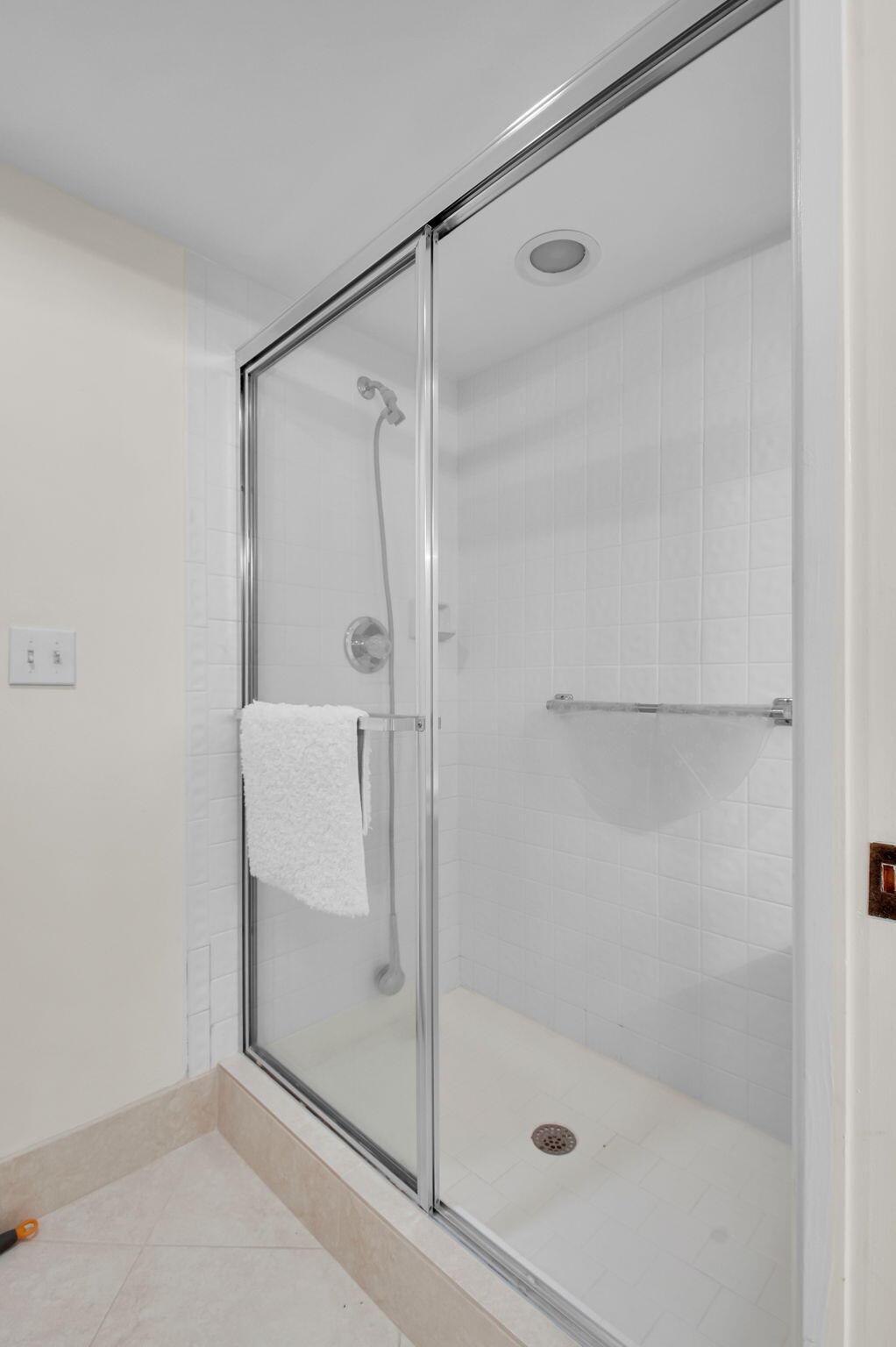 7380 Clunie Place, Unit 13006 Delray Beach, FL 33446 - Photo 15 of 67 a bathroom with a glass shower door