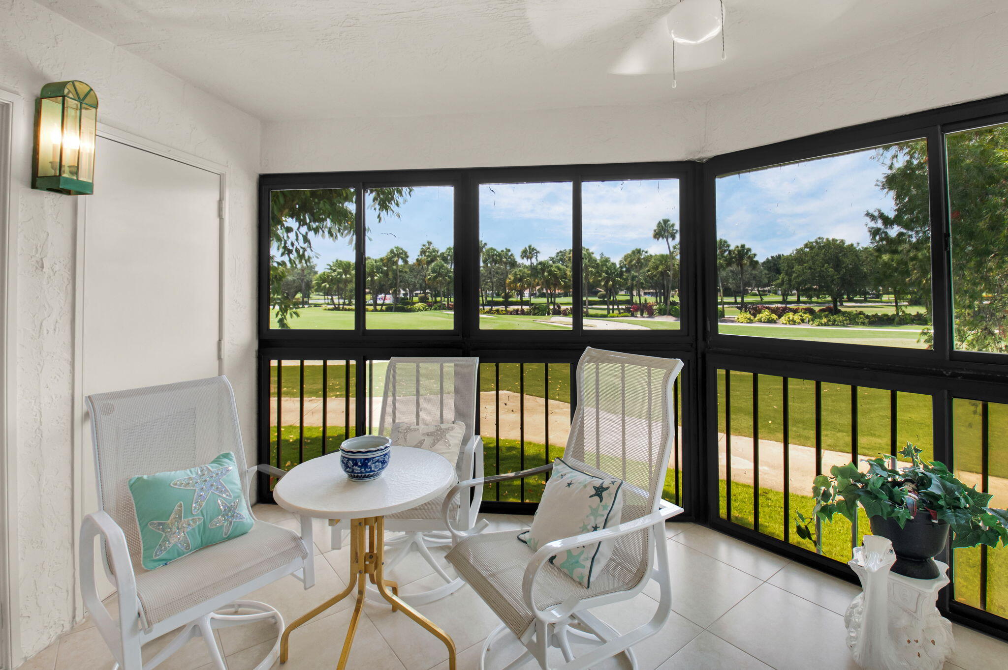 7380 Clunie Place, Unit 13006 Delray Beach, FL 33446 - Photo 16 of 67 a living room with furniture and a floor to ceiling window