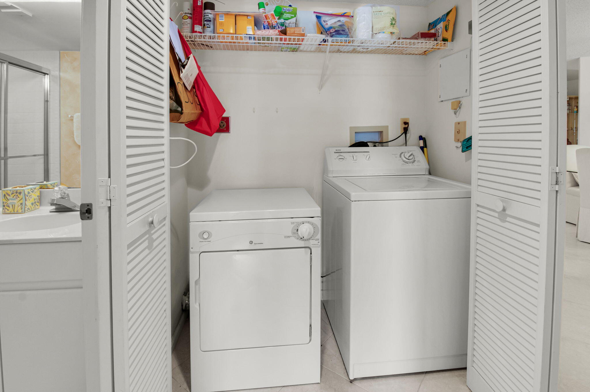 7380 Clunie Place, Unit 13006 Delray Beach, FL 33446 - Photo 25 of 67 a utility room with dryer and washer