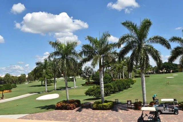 a view of a golf course with a lake view