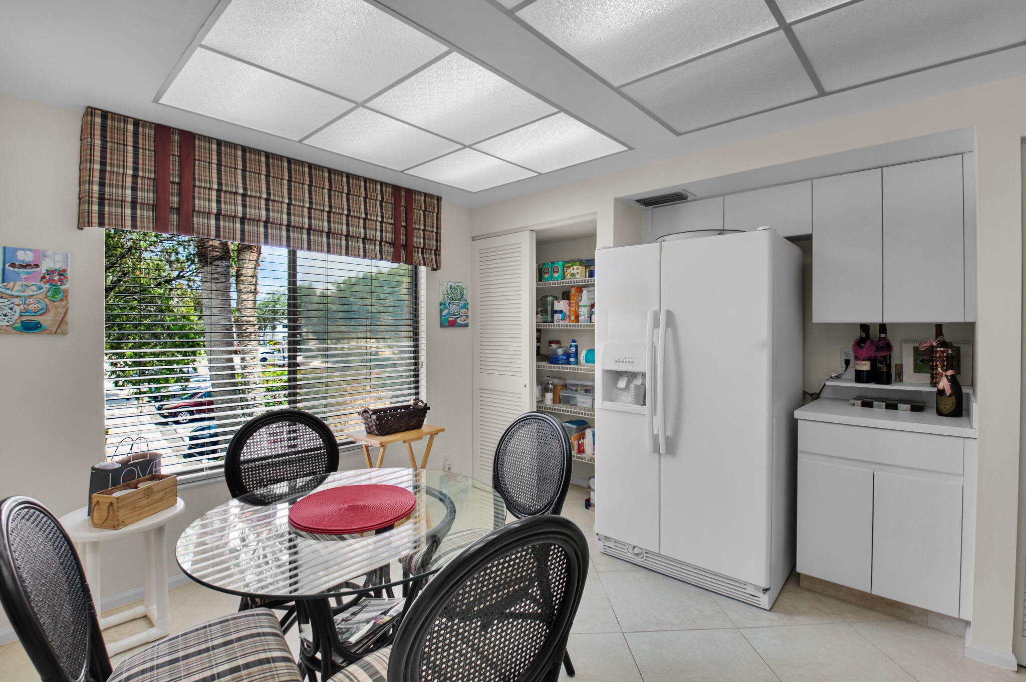 7380 Clunie Place, Unit 13006 Delray Beach, FL 33446 - Photo 10 of 67 a dining room with furniture and wooden floor