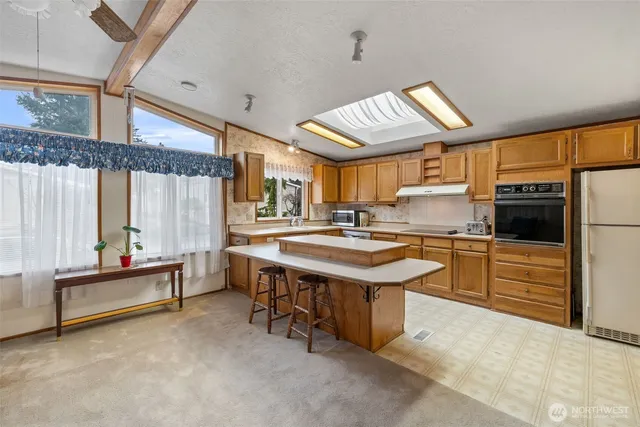 a kitchen with sink cabinets and window