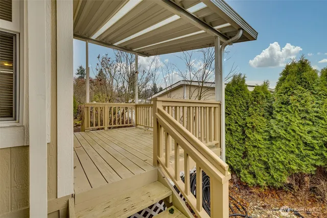 a view of balcony with wooden floor