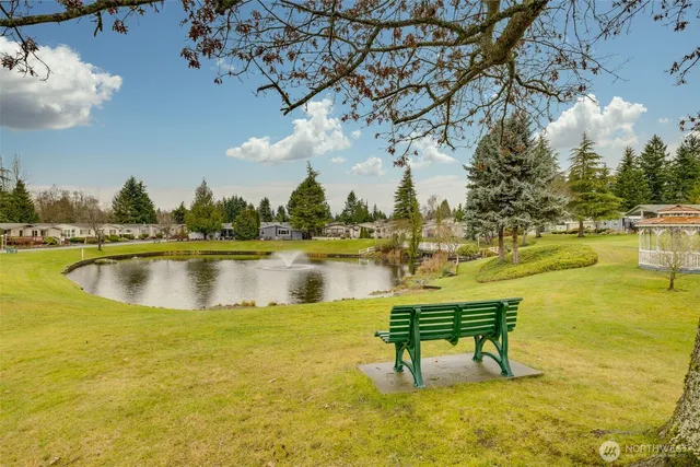 a view of a swimming pool with an outdoor space and seating area