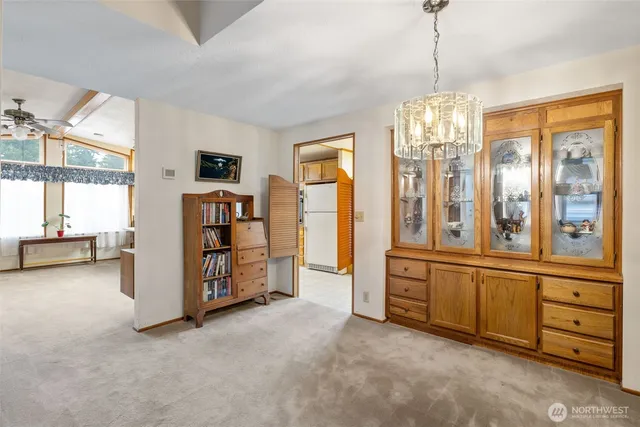 a view of a livingroom with furniture and windows