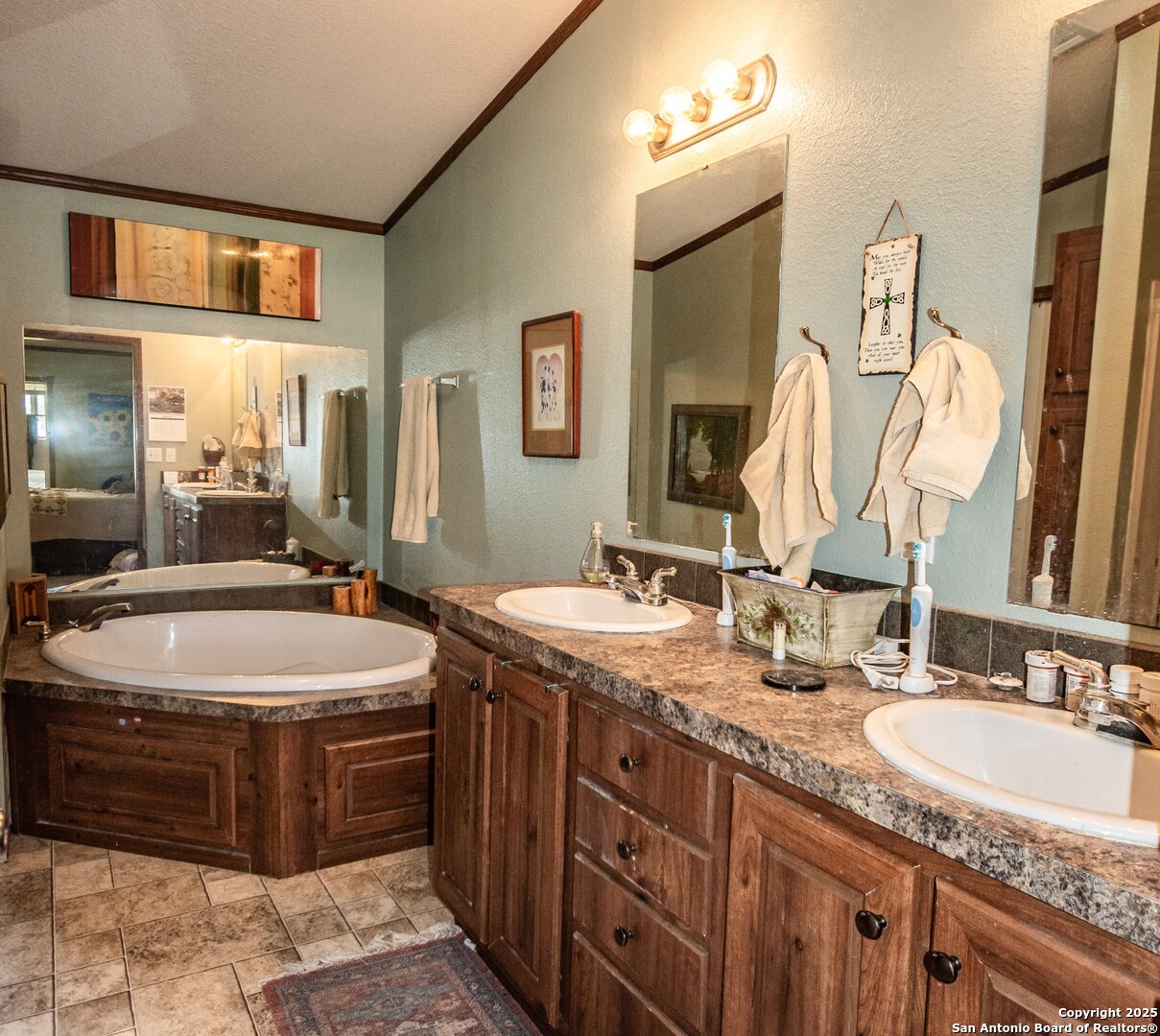 26701 Fm 470 Utopia, TX 78884 - Photo 13 of 36 a bathroom with a granite countertop sink and a mirror