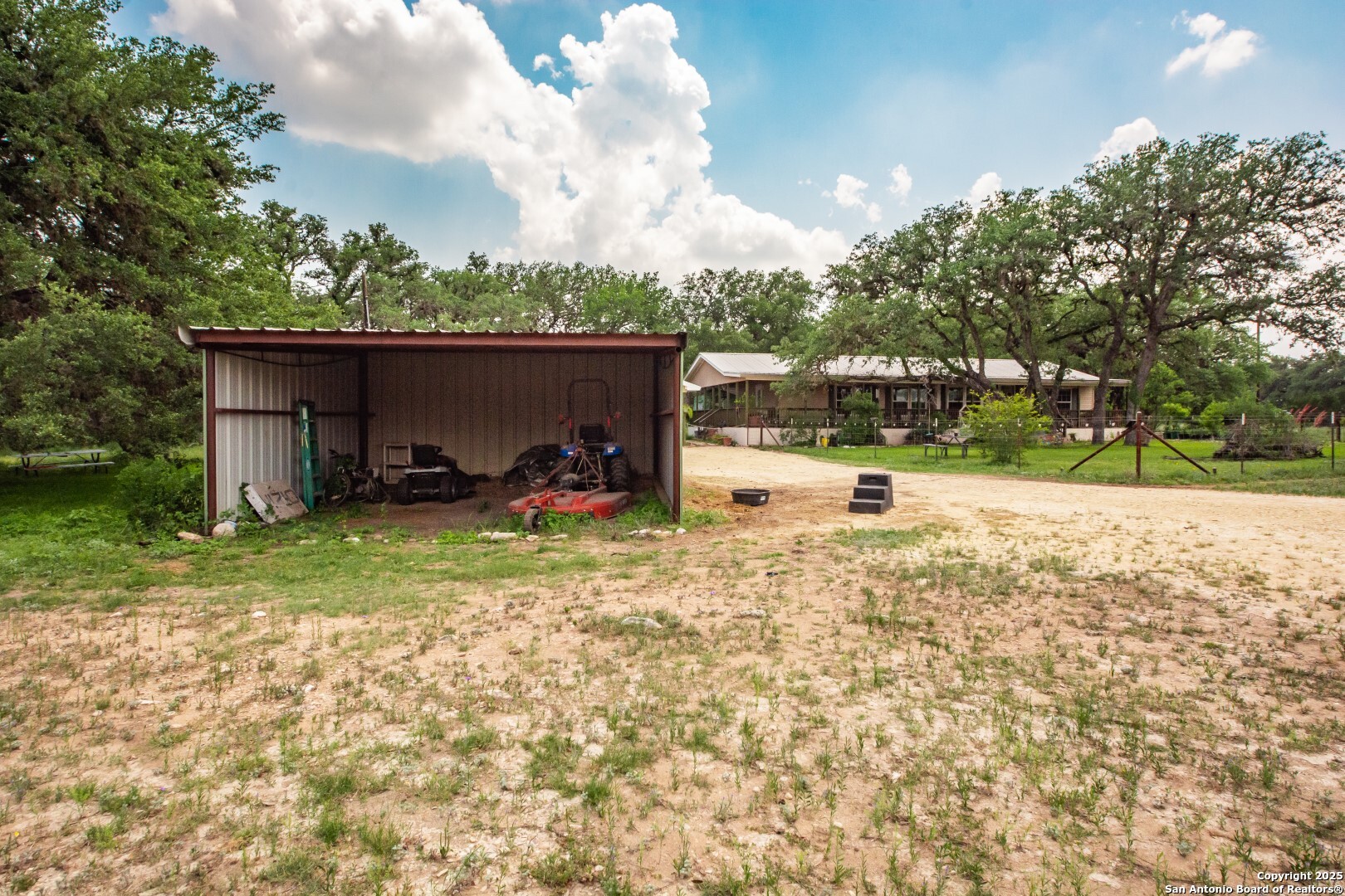 26701 Fm 470 Utopia, TX 78884 - Photo 2 of 36 a backyard of a house with a yard and outdoor seating