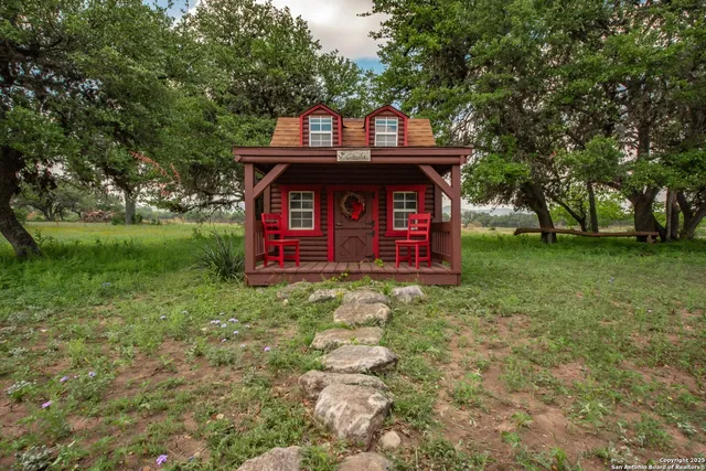 a view of bedroom with furniture and wooden floor
