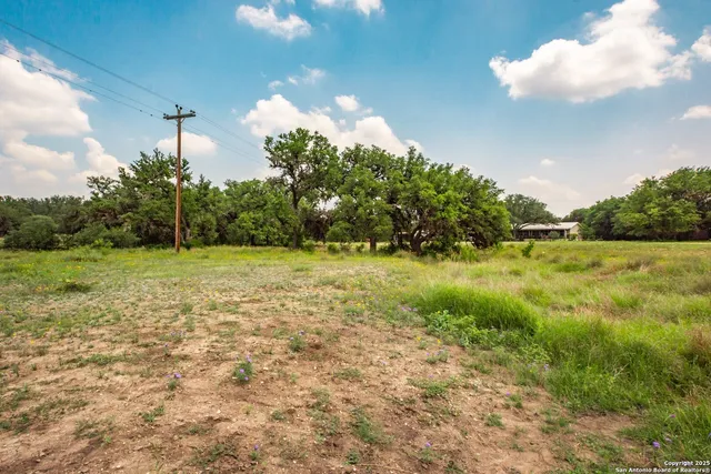 a view of a backyard with sitting area