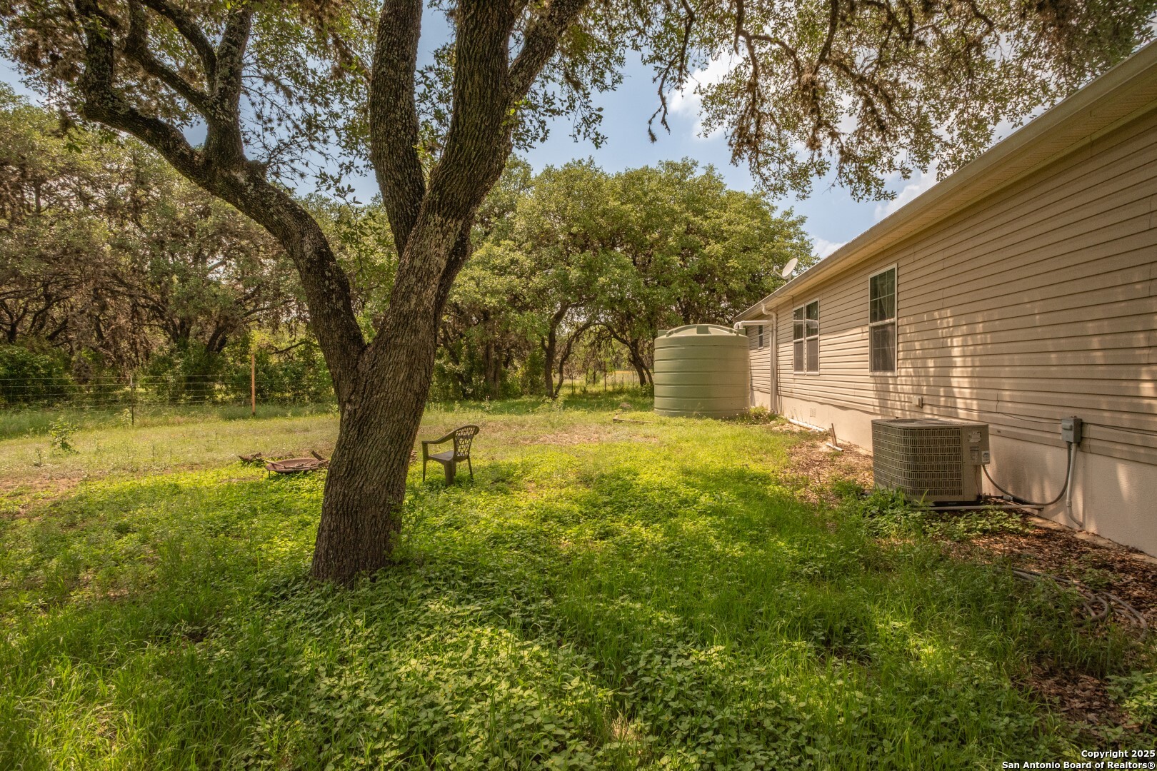 26701 Fm 470 Utopia, TX 78884 - Photo 34 of 36 a view of a yard with plants and large trees