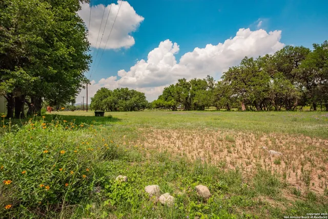 a view of a golf course with a lake