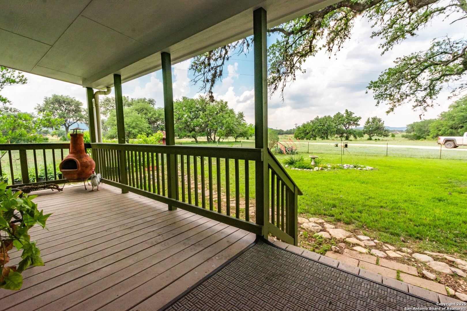 26701 Fm 470 Utopia, TX 78884 - Photo 7 of 36 a view of balcony with wooden floor and fence