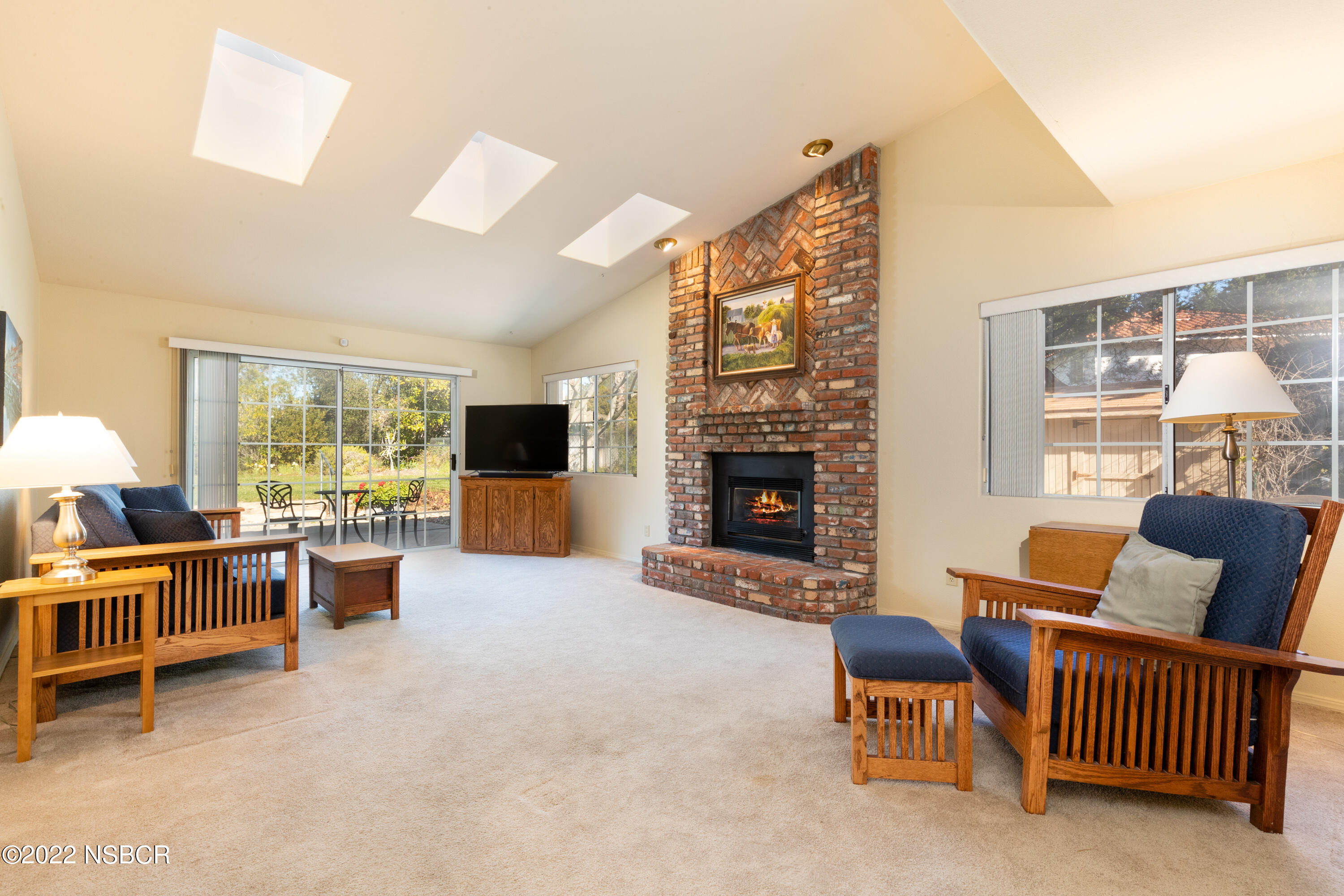 3185 Beck Road Lompoc, CA 93436 - Photo 3 of 27 a living room with furniture a fireplace and a flat screen tv