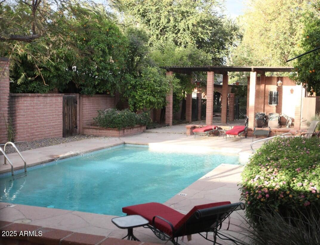 a view of a backyard with sitting area and furniture