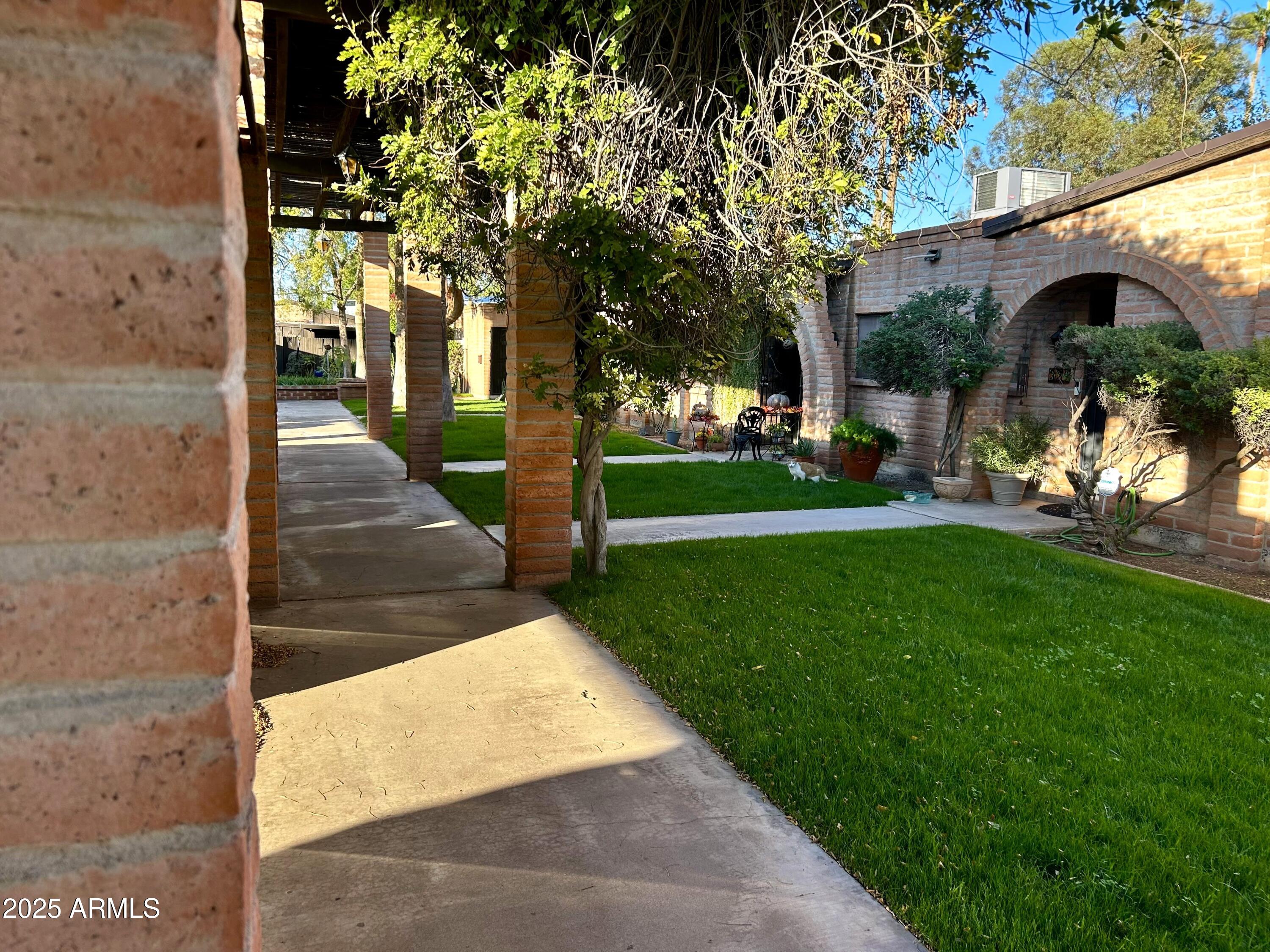 3046 North 32nd Street, Unit 333 Phoenix, AZ 85018 - Photo 13 of 16 a view of a porch with a tree