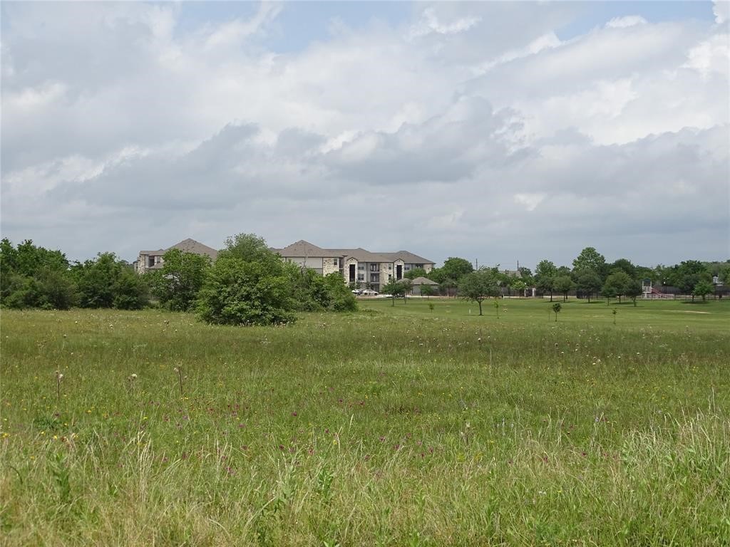 1500 Rexville Road Sealy, TX 77474 - Photo 4 of 4 a view of a lake with houses in the back
