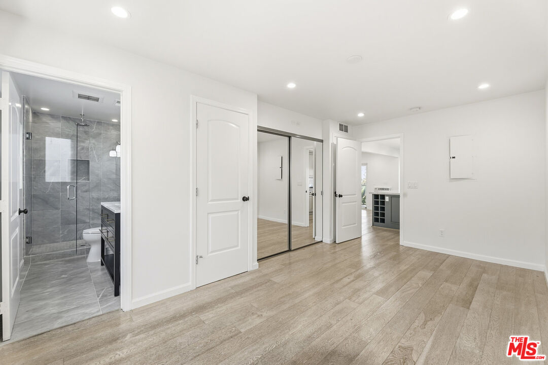 2442 South Coast Highway, Unit 4 Laguna Beach, CA 92651 - Photo 12 of 22 a view of a hallway with wooden floor