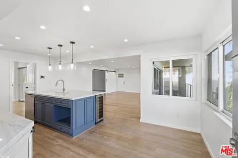 a spacious bathroom with a double vanity sink and a mirror