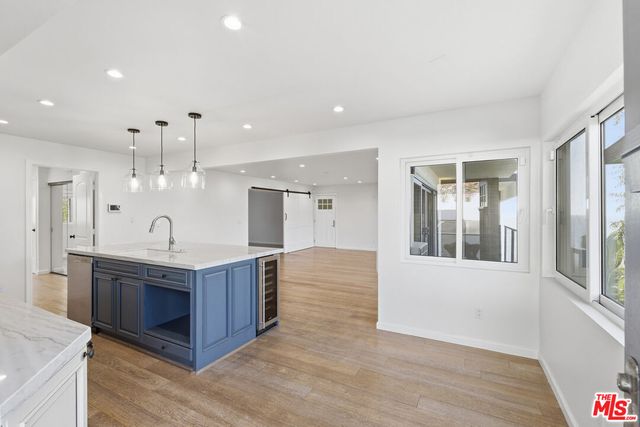 a spacious bathroom with a double vanity sink and a mirror